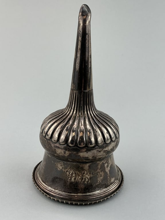 George III English Sterling Silver Wine Funnel.: Measures 6 inches high. Hallmarked Rebecca Emes & Edward Barnard I, London, 1809. Regency period wine funnel with reeded border and fluted mid-section. Good with tarnish and a dent at spout, monogramm