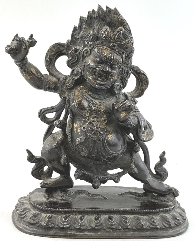 Tibetan Gilt- Bronze Statuette of Vajrapani.: Measures 7 inches high. Qing Dynasty, 19th century. Depicted in the warrior stance on a lotus platform trampling snakes, and holding a vajra (thunderbolt scepter). He is the revered protector of the B