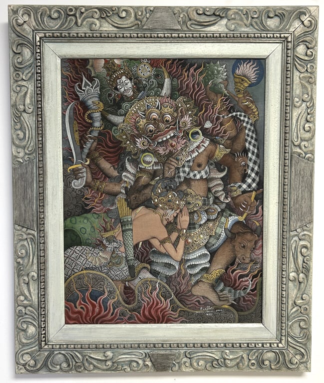 Balinese Painting on Fabric by Sukoda 1975.: In a carved wood frame, 29 x 35 inches. Signed lower right 75 Sukoda Padang - Tegal - Ubud, Bali. Depicts Rangda central monstrous figure and Barong appearing alongside in prayer. Condition: Very good