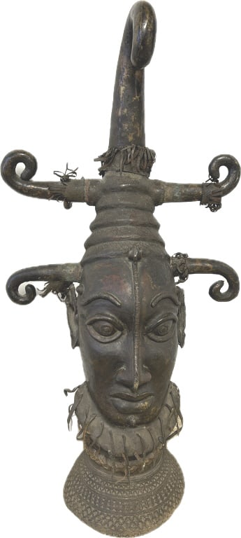 Large Edo Benin Bronze Head Sculpture.: 20 inches wide x 43 inches tall. 50 + lbs. Historically from the Benin Kingdom, located in present-day Southern Nigeria. Crafted by the Edo people, also known as the Bini people, who perfected the los