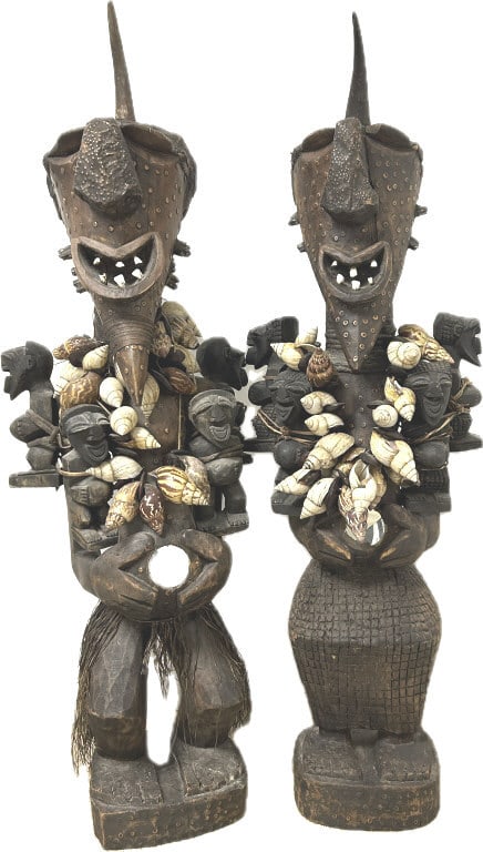 Antique Songye Carved Wood Power Statues.: 55 inches tall x 14 inches wide, 30-40 lbs each. Large carved Nkisi/Nkishi from the Songye people in the Congo, Africa. Male and female power fetish Nkishi figures adorned with shell necklaces, each h