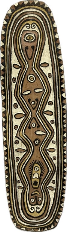 Papua New Guinea Carved & Painted Wood Shield.: 69 inches long x 19 inches wide. Oblong-form ceremonial shield with designs that represent ancestral spirits and totemic animals. Condition: Good with minor wear. **LOCAL PICKUP MUST BE BY APPT ONLY P