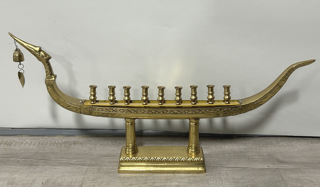 Vintage Thai Brass Dragon Boat Menorah.: 30 inches long x 15 inches tall. Dragon motif inspired by the Thai Suphannahong Royal Barge. Typically holds 9 candles. Condition: Very good. **LOCAL PICKUP MUST BE BY APPT ONLY POSTAUCTION ONLY ON SP