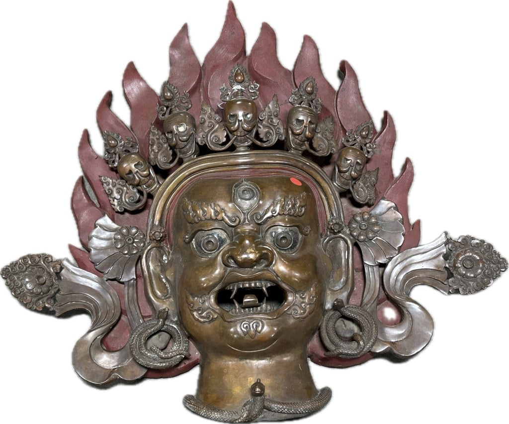 Tibetan Bronze Wall Mask of Mahakala.: 29"Hx29"W. Heavy, approximately 40-50 lbs. Antique/vintage bronze Mahakala mask, the most powerful protector in Tibetan Buddhism. Depicted with a 5-skull flaming crown and cobra necklace. Condition: