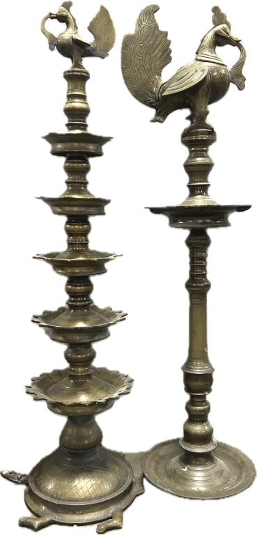 2 Vintage Indian Brass Deccan Oil Lamps.: 54"H. Stylized peacock finials, traditional Indian Nilavilakku or Kuthu Vilakku, used in religious rituals. One has a turtle-form base. Condition: Very good. **LOCAL PICKUP MUST BE BY APPT ONLY POSTAU