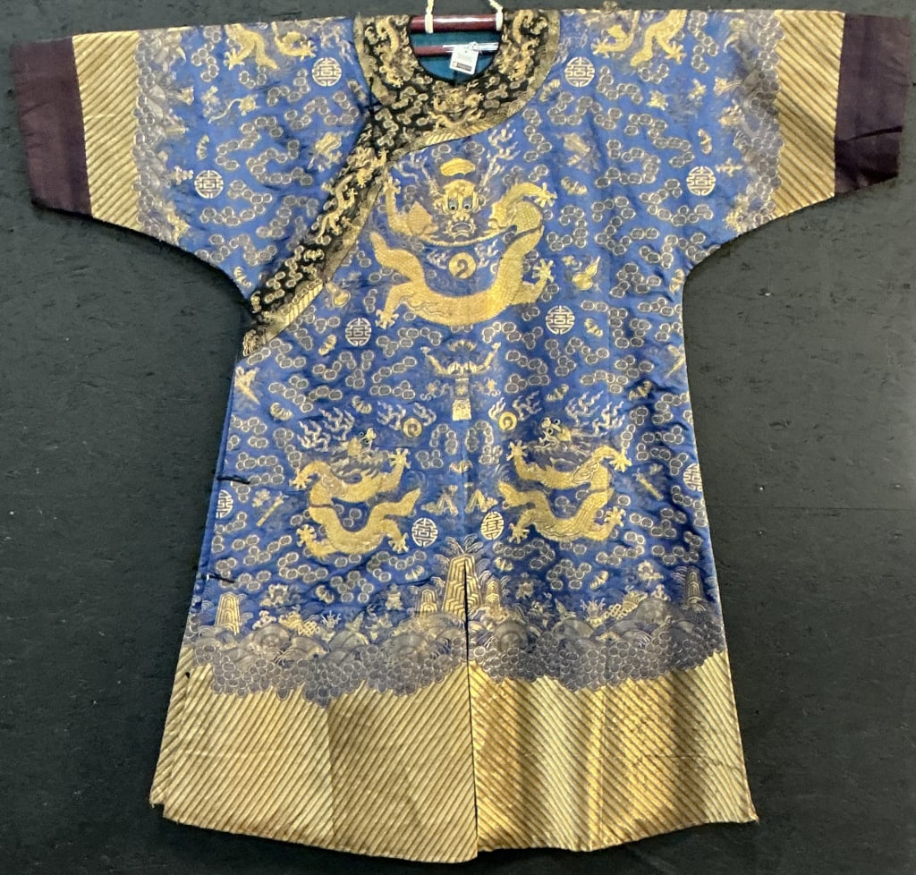 Chinese Qing Dynasty Silk Imperial Dragon Robe.: 55"Hx54"W. 19th century with gold-thread embroidery on blue ground. Depicting 5-clawed dragons chasing flaming pearls, surrounded by ruyi clouds, bats and symbols for longevity. Condition: Good with w