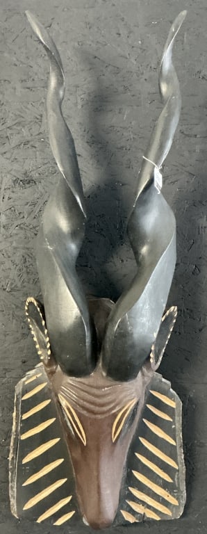 Vintage African Antelope Head Wall Hanging.: 36"L . Hand-carved and painted wood helmet-style mask. Condition: Good with minor damage and wear. **LOCAL PICKUP MUST BE BY APPT ONLY POST AUCTION ONLY ON SPECIFIC DATES:CALL 717-272-7078 TO MAKE AN 