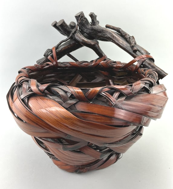 Large Signed Japanese Bamboo Hanakago Basket.: 16"Hx18"W. Likely Meiji period (1868-1912) hand-woven smoked bamboo ikebana (flower arranging) basket with bentwood wisteria branch handle. Condition: Very good with minor wear.**LOCAL PICKUP MUST BE 