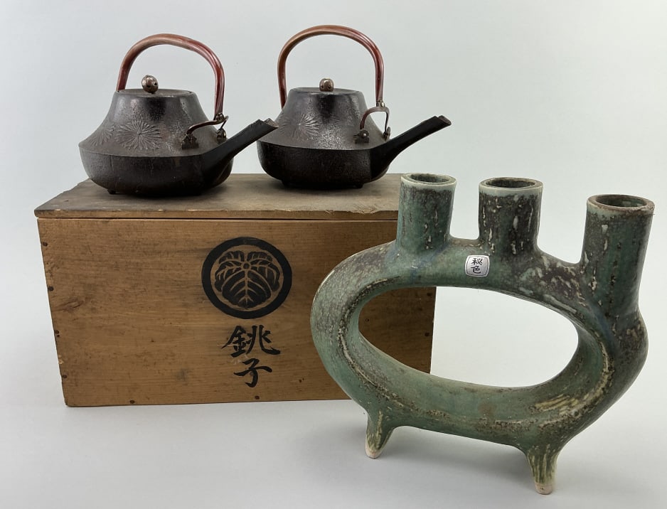 Japanese Choshi Sake Set, Pottery Vase.: Largest: 13"W. Matching pair of cast iron sake servers with chrysanthemum decoration, original box features the kanji characters for Choshi, alongside a family crest (mon). Japanese turquoise glazed i