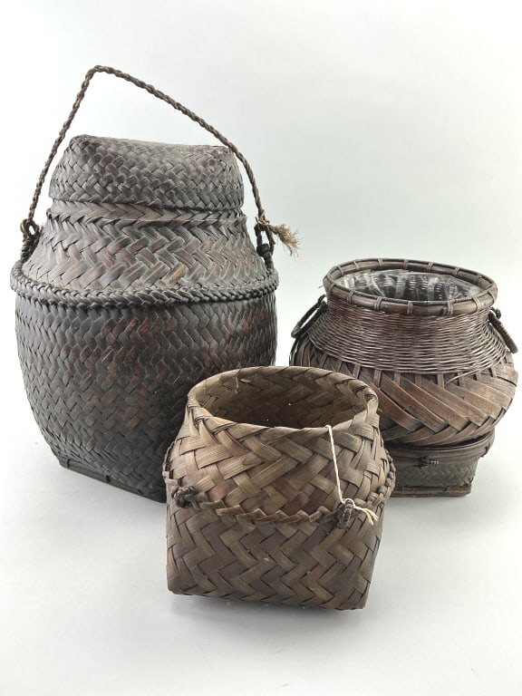 3 Antique Asian Woven Bamboo Baskets.: Largest: 13"H. Late 19th/early 20th century hand-woven bamboo and rattan baskets, including Ifugao Ulbong Rice basket, Thai Akha basket and Ikebana flower basket known as hanakago. Condition: Good wit