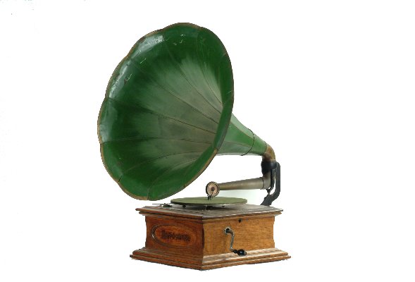 Zonophone Concert Grand Phonograph,: with Zonophone soundbox on tapering tone arm, double-spring motor, oak case with oval front panel, and green Morning Glory horn, 23 in. diam.