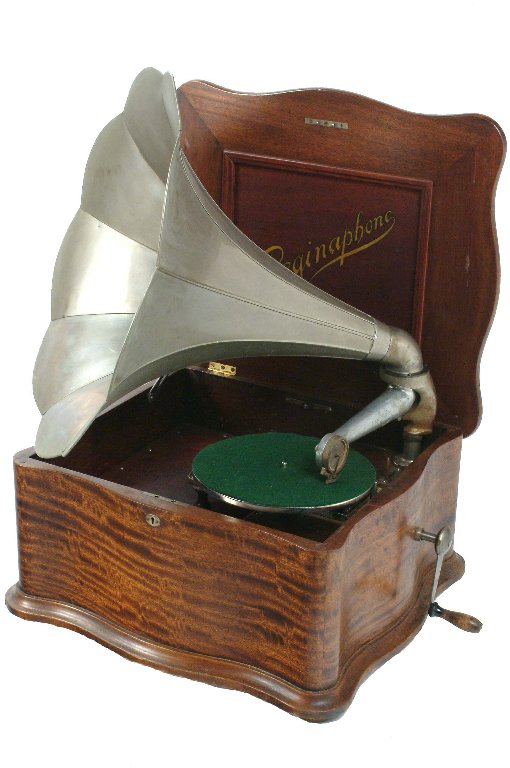 Reginaphone 15 1/2-inch Disc Music Box: and phonograph, Model 150, No. 1500063, with double comb short bedplate mechanism, zither-attachment, speed control, 10-inch turntable, cast tone arm with needle-clip soundbox and nickeled flower horn