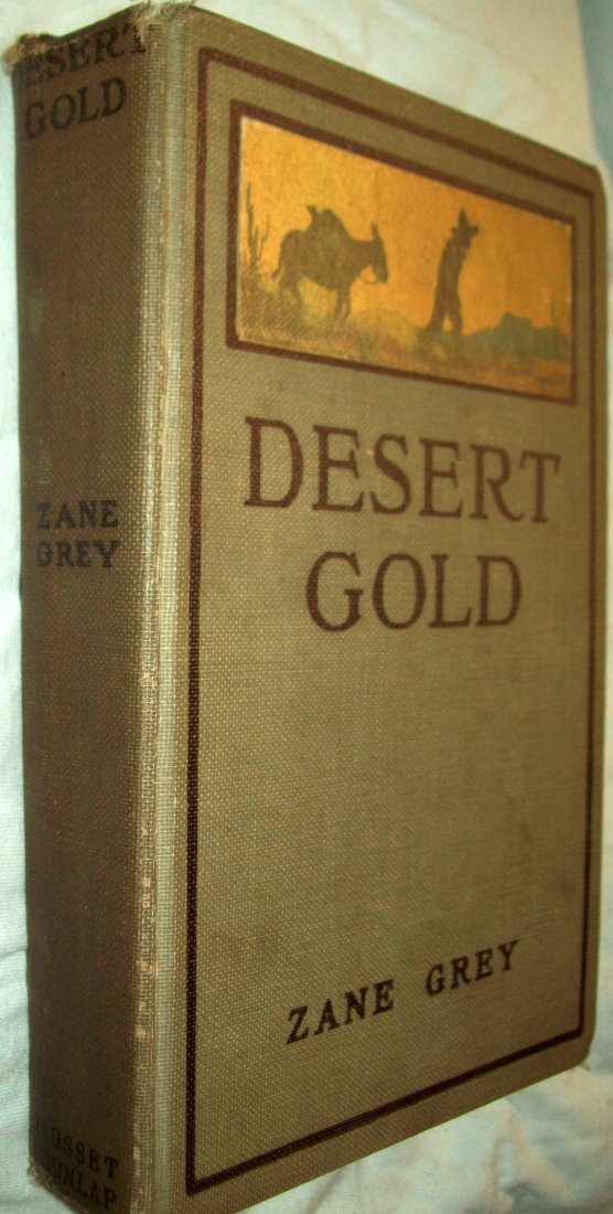 Desert Gold A Romance of the Border Zane Grey HB (1913): Grosset & Dunlap, New York, 1913. Hardcover. Douglas Duer (illustrator). PLATE FRONTISPIECE 3 PLATE ILLUSTRATIONS. Good gray cloth with color illustration on cover. 326pp. plus advertisements. Beautif