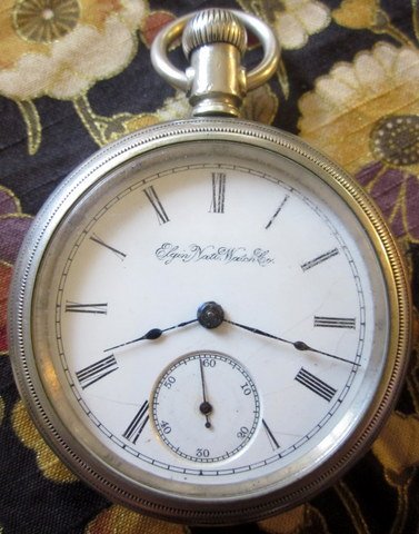 Elgin 1894 11j 18s Pocket Watch: This handsome watch features Safety Pinion, Swing Out Case, Indigo Spear hands, Adjusted to Temperature and Position and is enclosed in a heavy Star & Crescent Moon Trade Mark watch case.