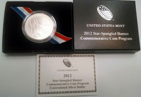 US Mint 2012 Star-Spangled Banner Silver Dollar UNC COA: The United States Mint issued the 2012 Star Spangled Banner Silver Dollar to commemorate the War of 1812, particularly the Battle of Baltimore that formed the basis for the lyrics of the Star Spangled