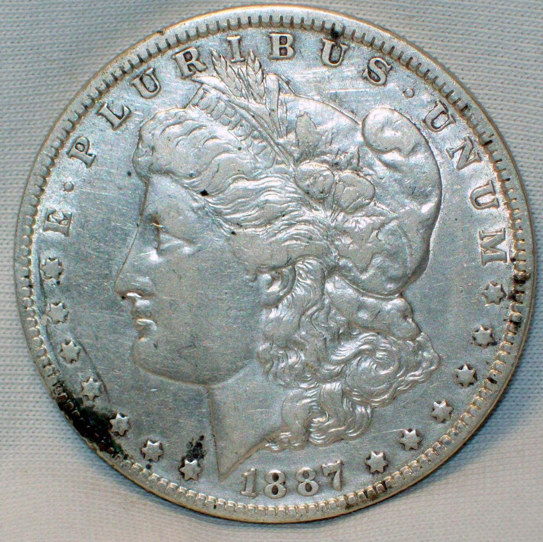 1887-O Morgan Silver Dollar VF/XF (1 of 2)