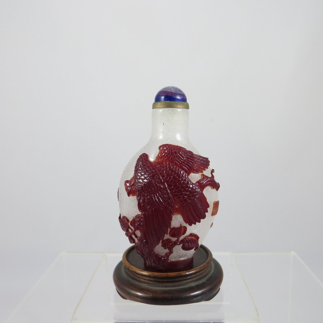 Chinese Qing Dynasty Glass Snuff Bottle: Chinese Qing Dynasty Peking Glass Snuff Bottle featuring a bird catching a fish and eagle motif. Artist seal mark. Provenance: Mr. Paul Stern, acquired from J. M. HU. H: 3"