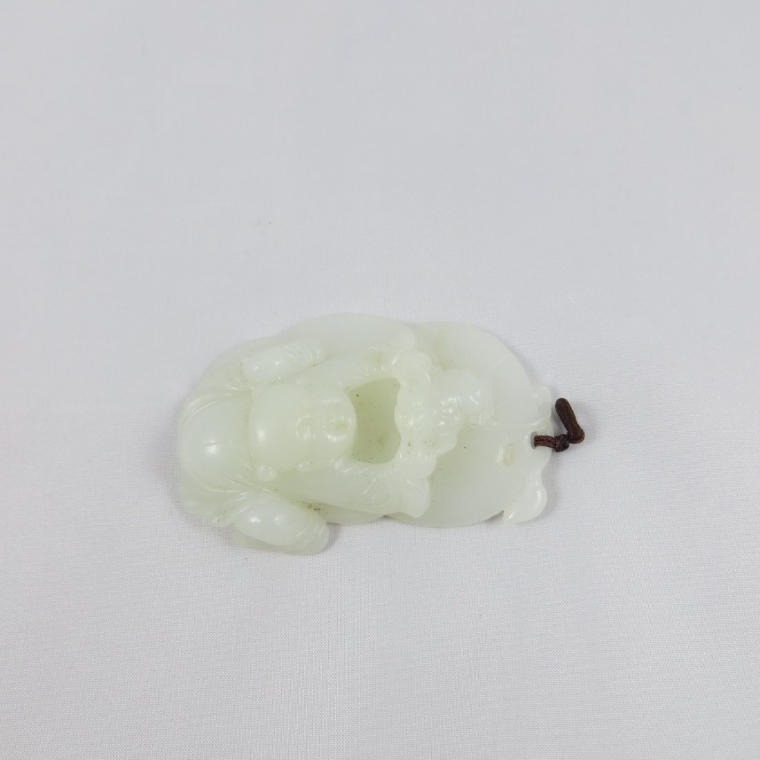 Chinese Qing Dynasty Hetian Jade Pendant: Chinese Qing Dynasty Hetian Suet/Mutton Fat Jade Pendant featuring a boy. 清代和田羊脂白玉雕件H: 2 1/2"
