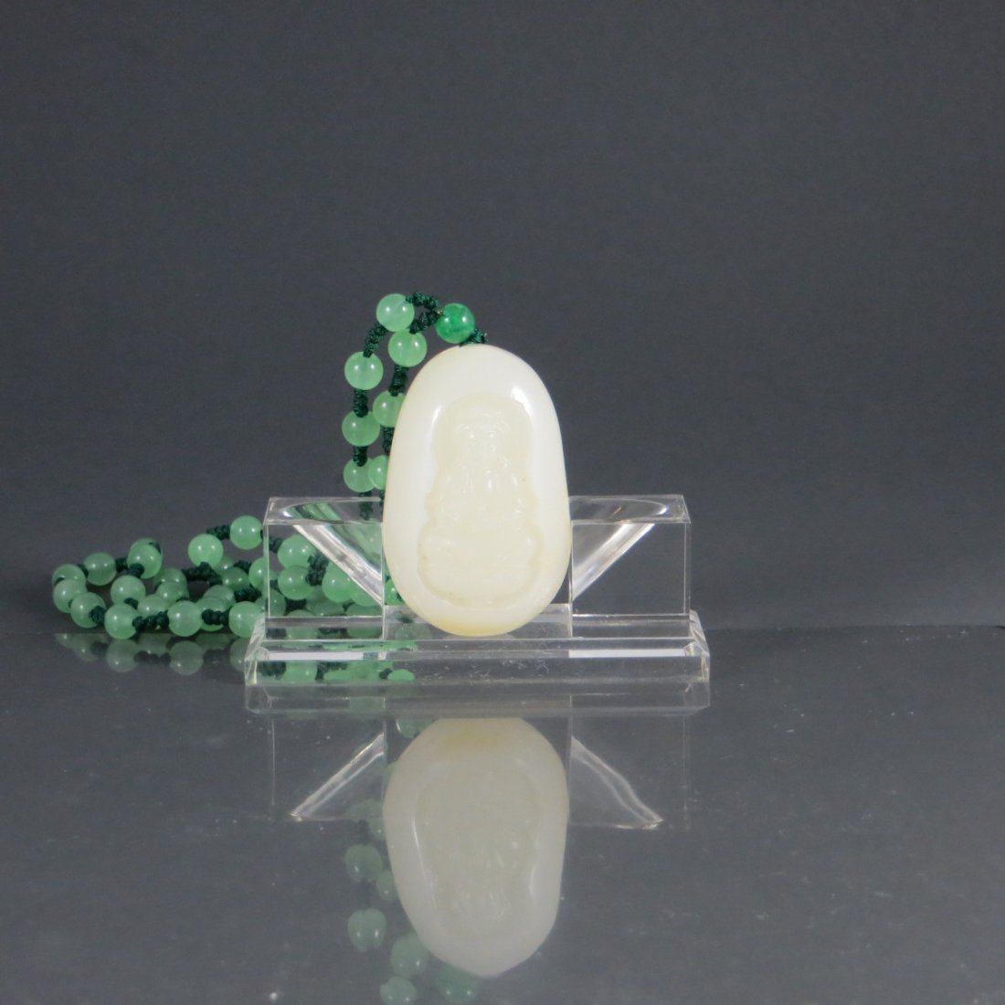 Chinese Hetian White Jade Necklace/Pendant: Chinese Hetian White Jade Necklace/Pendant, featuring a guanyin. Provenance: from Mr. Paul Stern collection, Toronto. 和田白玉观音挂件。