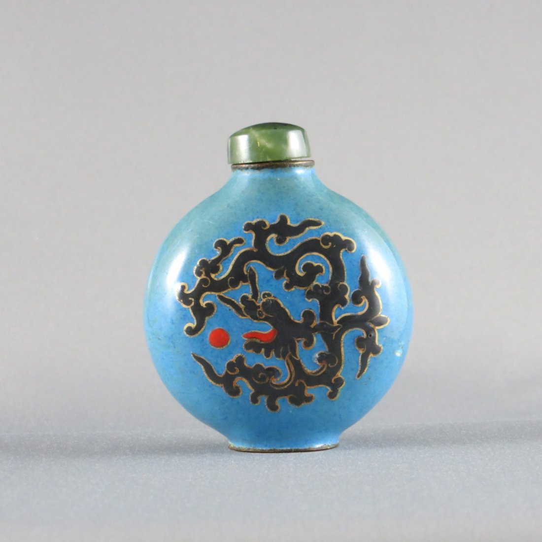 Chinese Qing Dynasty Enamel/Cloisonne Snuff Bottle: Chinese Qing Dynasty Enamel/Cloisonne Snuff Bottle,featuring a dragon playing with a red fireball motif. Provenance: from Mr. Paul Stern collection, Toronto. Acquired from J. M. HU