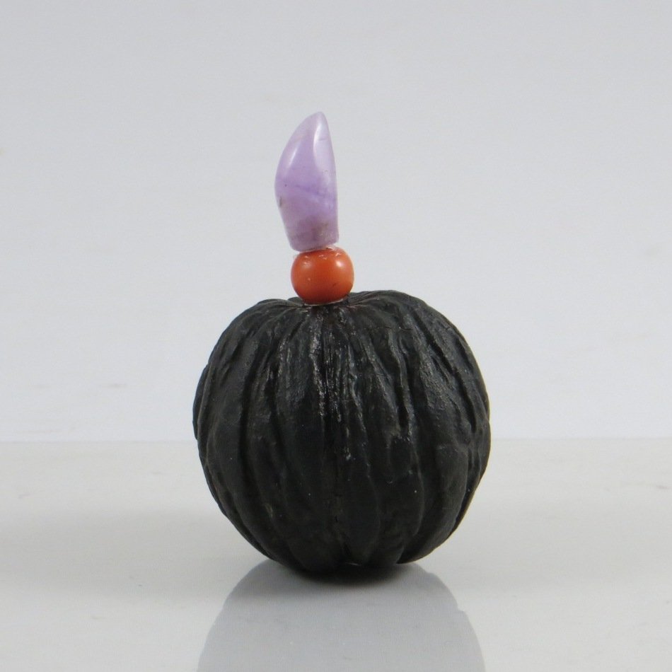 Chinese Qing Dynasty Walnut Snuff Bottle: A very rare Chinese Qing Dynasty Walnut Snuff Bottle, with rose quartz and red coral stopper, uncarvedTotal height: 5.5cm, Weight: 22.1gProvenance: from Mr. Paul Stern collection, Toronto. Acquired fr