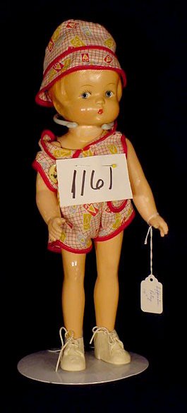 All Composition Doll Marked Effanbee Patsy NR: All composition doll; marked EFFANBEE Patsy on back; painted features, painted and molded hair. (Cracked head, hand and leg, repainted with flaking overall.) 14" All dolls sell As Is, Where Is, no gua