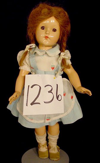 All Composition Doll Marked Effanbee NR: All composition doll; marked Effanbee USA on head and back; sleep eyes with hair or fur lashes, closed mouth, wig hair. (Face crazed, right finger needs repaired.) 17" All dolls sell As Is, Where Is,