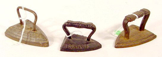 3 Cast Iron Victorian Toy Sad Irons NR: 3 Cast iron Victorian toy sad irons: first is unmarked, 3 1/4" L; second has molded "RARICAL"on its side, 2 1/4" L; third has molded 2 on top, 3 1/4" L. (A little wear and rust.)* All items sell As Is