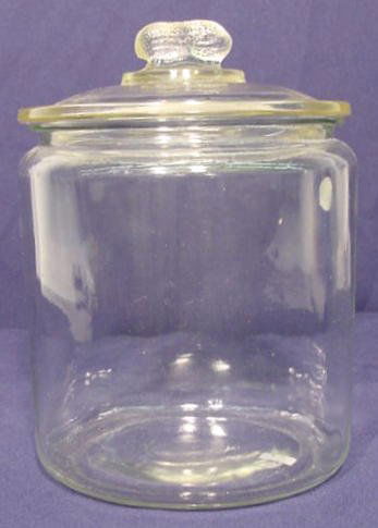 Glass Jar with Peanut Finial NR: Glass jar with peanut finial, no wording. (no condition problems) 9 3/4"T.