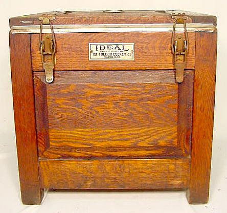 Oak "Ideal Cooker": Oak "Ideal Cooker Mfg. by The Toledo Cooker Co., Toledo, OH."; all original, lock-down lid, aluminum interior w/ containers. (bottom board damaged.) 15"T x 15"W x 15"D.