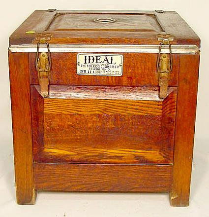 Oak "Ideal Cooker": Oak "Ideal Cooker Mfg. by The Toledo Cooker Co., Toledo, OH."; all original, lock-down lid, aluminum interior w/ containers; dated April 14 '14; July 7, 1914. (bottom board damaged.) 15"T x 15"W x 15"