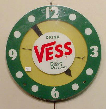 "Drink Vess" Beverage AdvertIsing Clock NR: Advertising clock "Drink Vess - Billion Bubble Beverages"; metal case, Plexiglas dial, no makers name in sight. (Overall condition: some surface scratches on the front.) Running at time of cataloging