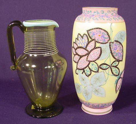2 Glass Items NR: 2 glass items 1) Olive green glass pitcher with applied handle & pale blue glass threading around top; ground pontil, unmarked (No condition problems.) 7 3/4" T 2) Milk glass vase decorated in colors