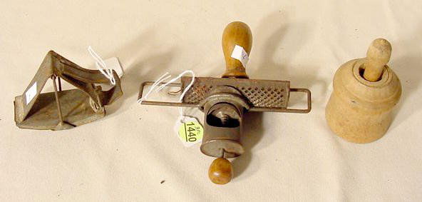 2 Nutmeg graters & A Butter Mold NR: 2 nutmeg graters and a butter mold. 1) Tin boat shape w/ a rocking arm grinder. (No condition problems.) 2 5/8" T x 3 1/4" L 2) Tin and wood w/ a rolling and sliding action sprint load into round cyli