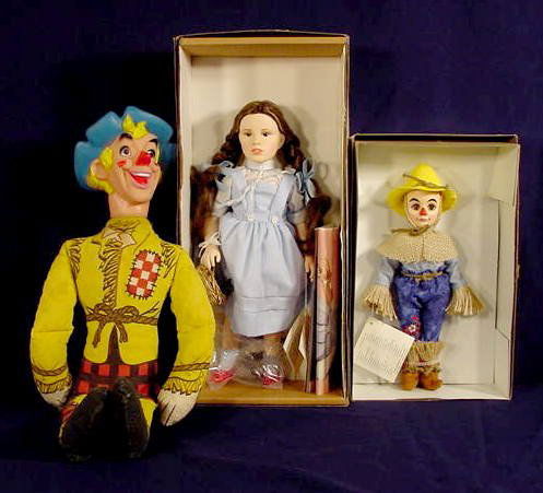 Effanbee Wizard of Oz Dolls Judy Garland NR: 3 Items RP & Co. cloth stuffed Scarecrow doll with attached rubber head (Some tears under arms and body from use/play.) Marked on back of head. Approx. 22" 1984 Effanbee Judy Garland-Dorothy doll in o