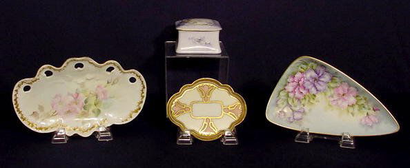 H.P. Box, Oblong Tray, Pin Tray & Triangular Tray: 4 Hand painted items: 1) Square box with purple flowers and green vines on a light purple and white ground. Marked Bavaria. Interior lustre painted. No condition problems. 2 1/2" T x 3 5/8" x 3 5/8".