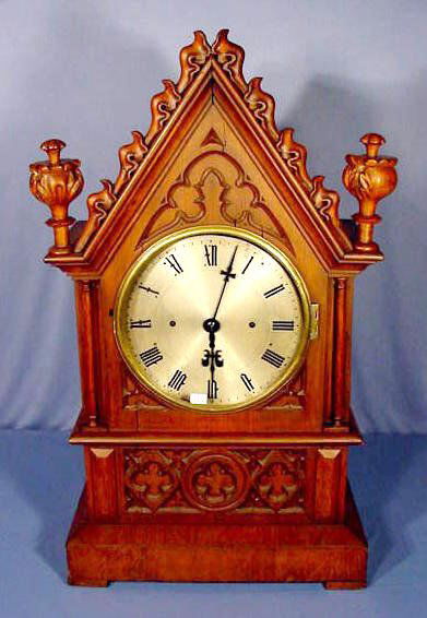 Gothic Style 3 Train Fusee Clock NR: Gothic Style 3 Train Fusee Clock, 8 day, time and strike 5 gong, and a 10" silvered dial. Movement is early 1800's with wood round stick and brass cylinder shaped pendulum. Gongs are stamped "J.D.". O
