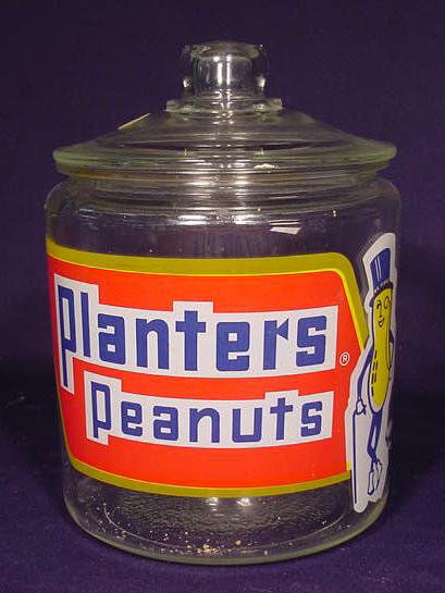 Planters Peanut Glass Jar NR: Planters Peanut Glass Jar with a colorful decal. (Chip on inner rim of the jar.) 10" T