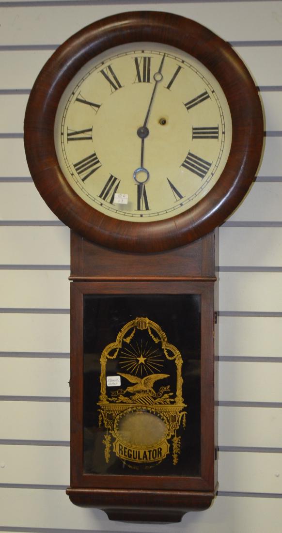 Seth Thomas Plymouth Hollow Walnut Regulator No. 1 Wall: Seth Thomas Plymouth Hollow Walnut Regulator No. 1 Wall Clock: TO with an unsigned paper dial, the pendulum, weight and an eagle stenciled door. Has not been tested. Sells as is, where is. Dimensions: