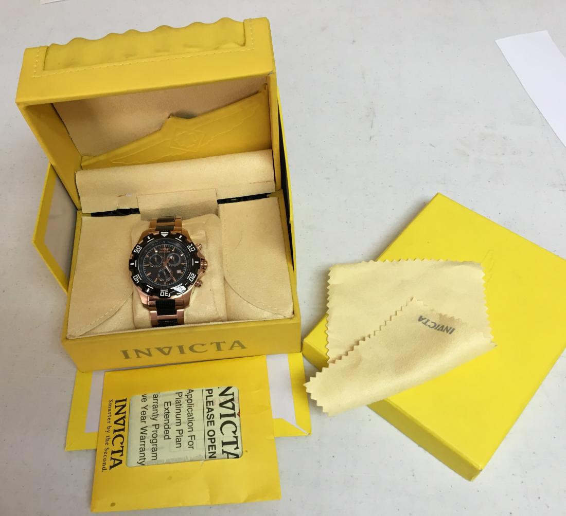Invicta Speciality Collection Chronograph Model 1221:: Description: Invicta Speciality Collection Chronograph Model 1221: Rose gold colored with black inlay in the band. 100mm water resisitant. With a Flame Flame Fusion crystal. In the original box with a