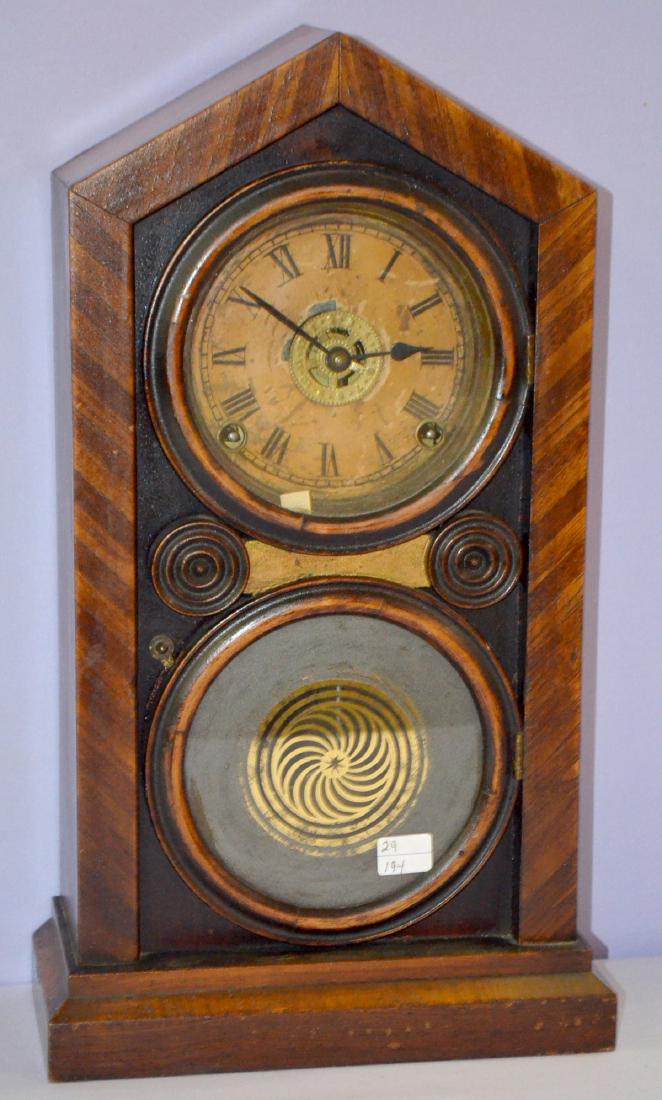 Antique E. Ingraham "Doric" Shelf Clock: Antique E. Ingraham "Doric" Shelf Clock: T, S and Alarm, in a veneered case, with an unsigned dial, the pendulum, gong and bell strike, an interior label and painted lower door. Has not been tested. S