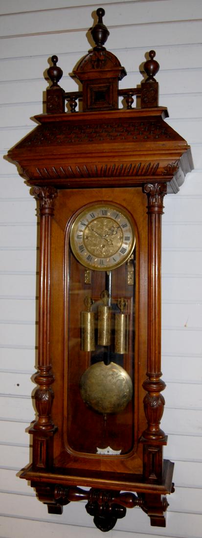 3 Weight Fancy Walnut Vienna Regulator Wall Clock: 3 Weight Fancy Walnut Vienna Regulator Wall Clock. Ornate carved castle top case with carved columns & bottom, all matching engraved dial, weights & pendulum, (minor scuffs to case.) Has not been test