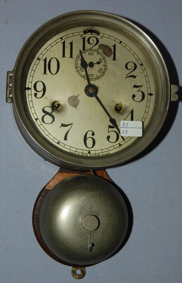 Seth Thomas Ship's Bell Clock: Seth Thomas Ship's Bell Clock. T&S, signed enamel dial with seconds bit; metal case & bell mounted on board. (some chips to the enamel dial.) Has not been tested. Sells as is, where is. 11"T