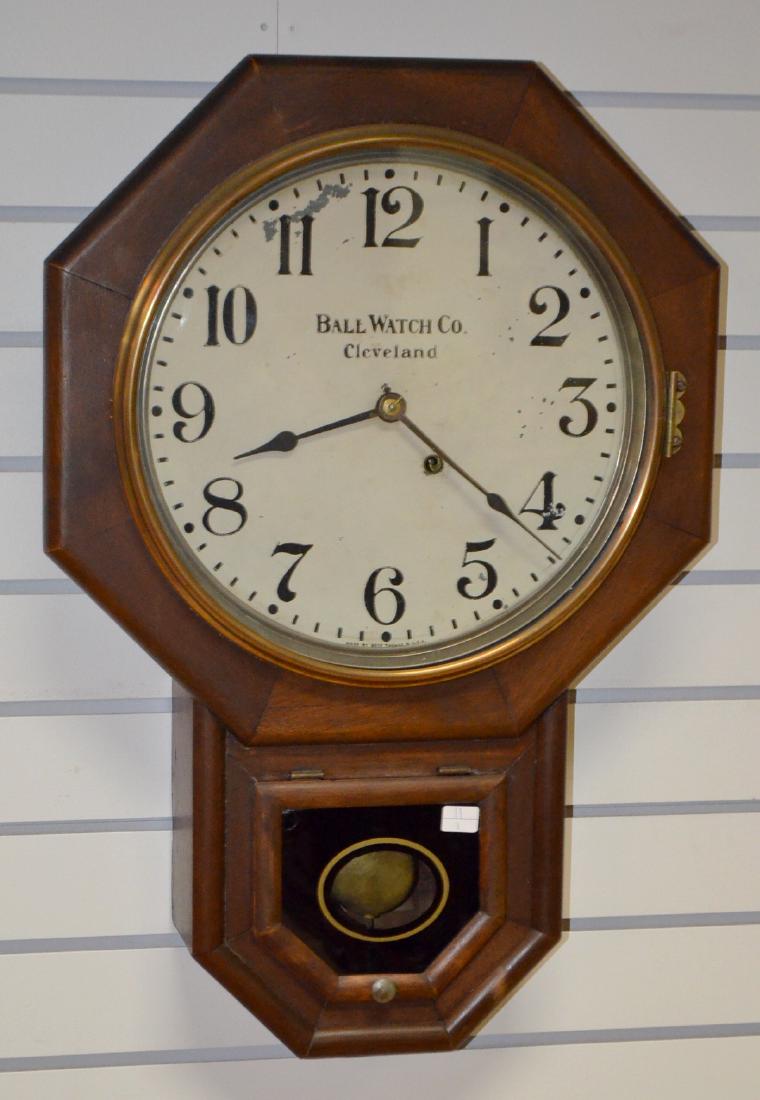 Seth Thomas Ball Watch Co. Short Drop Clock: Seth Thomas Ball Watch Co. Short Drop Clock: TO; signed painted metal dish, has pendulum; interior label; painted glass pendulum door. 24" T Has not been tested. Sells as is, where is.