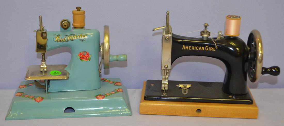 2 Children's Toy Sewing Machines, Pressed Steel: 2 Children's Toy Sewing Machines, Pressed Steel: 1.) KAYANEE Sew Master, blue with pink floral decals. The sewing plate is marked "Berlin, Made in Germany". (There is no needle.); 2.) American Girl, b