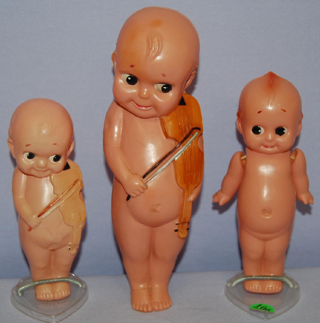 3 Celluloid Kewpie Dolls, Marked "Made in Japan": 3 Celluloid Kewpie Dolls, Marked "Made in Japan": 2 have violins and painted features. (The paint on the violin of the smaller Kewpie is very faded.) The other has jointed arms and green wings. All se