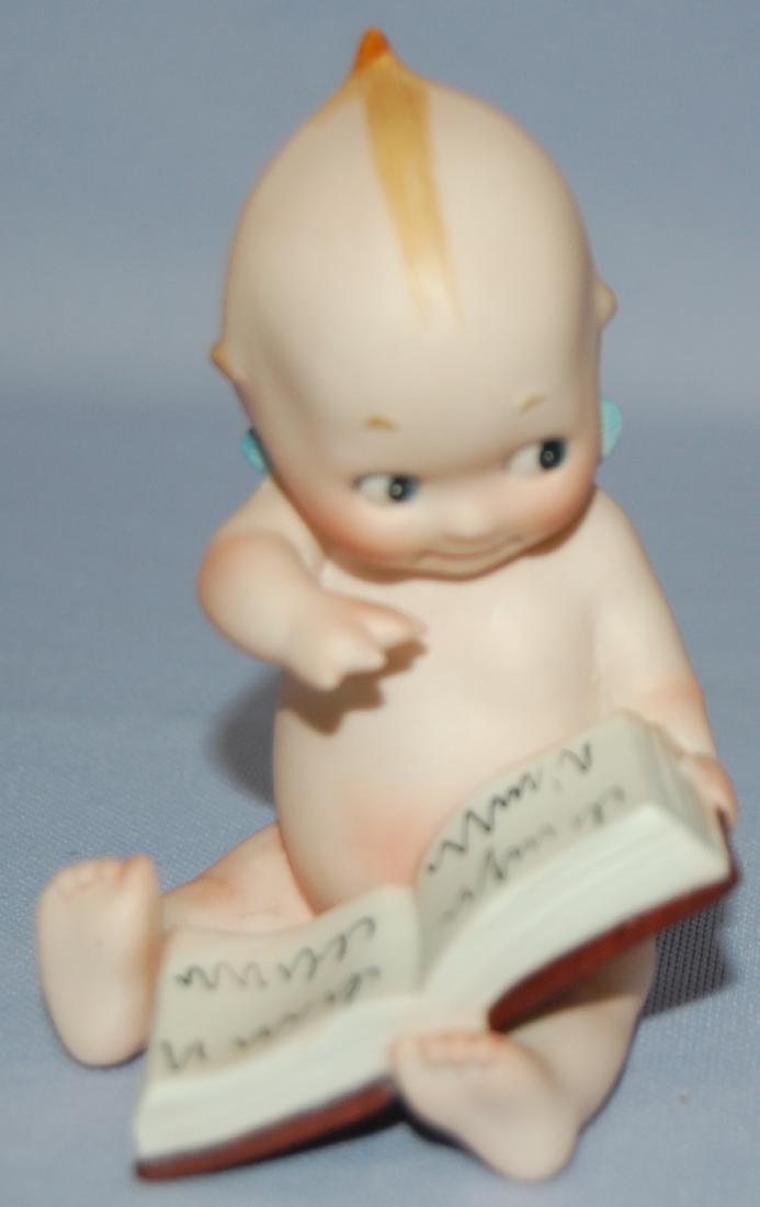Antique German Bisque Rose O'Neill Kewpie Reader: Antique German Bisque Rose O'Neill Kewpie Reader: painted features, marked C in circle and O'Neill on the base; holding an open book. 3 1/2" T Sells as is, where is.