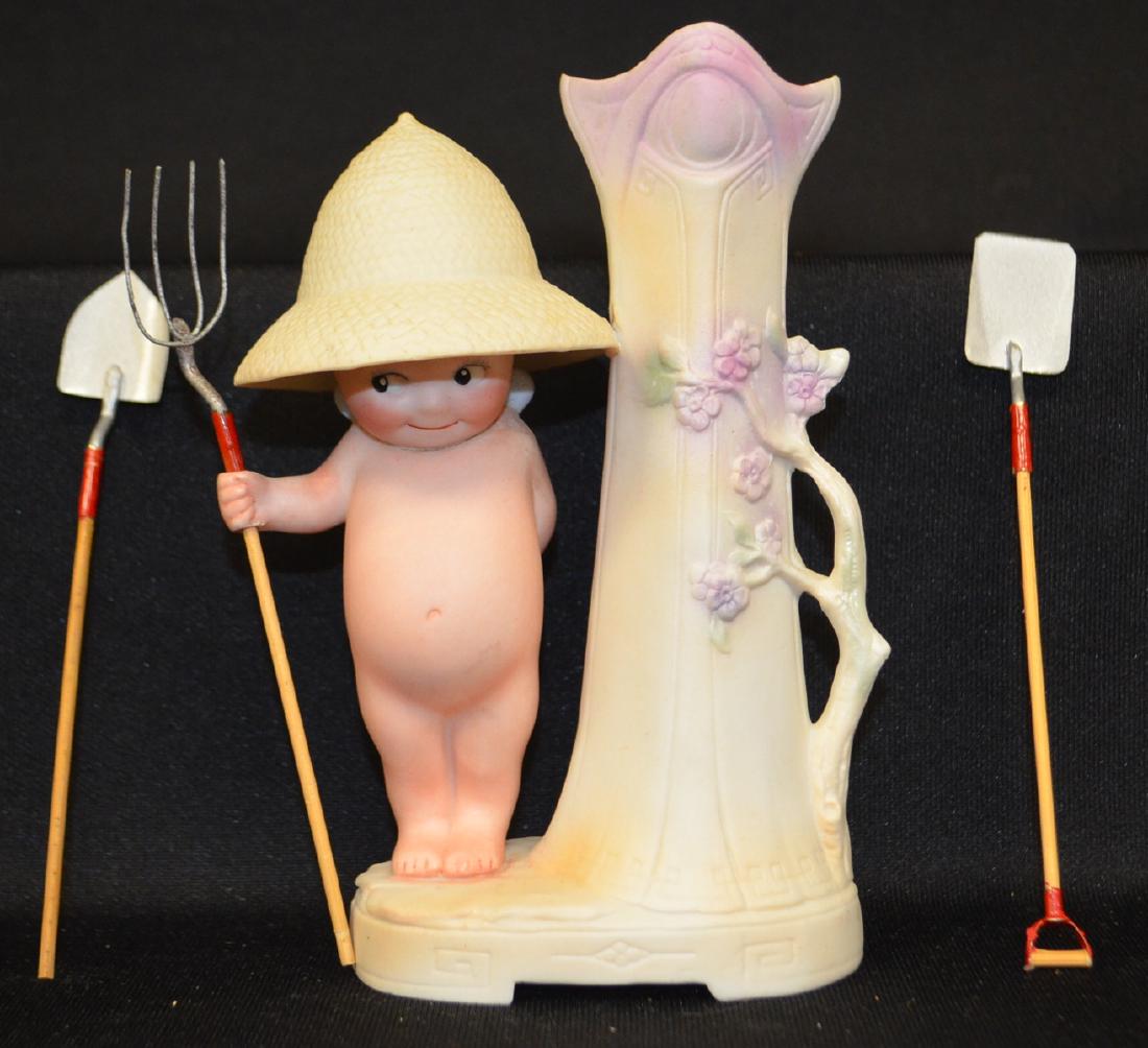 "The Gardener" Figural Flower Vase: "The Gardener" Figural Flower Vase: With extra tools. It has the © mark on the bottom. Sells as is, where is. 6 3/4" Tall