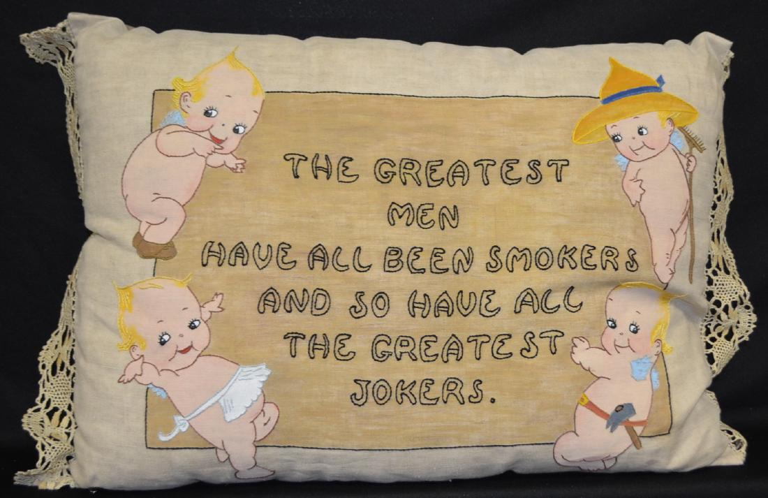 Embroidered Kewpie Pillow, Smokers/Jokers: Embroidered Kewpie Pillow "The Greatest Men Have All Been Smokers and So Have The Greatest Jokers"; painted and embroidered on linen with 4 Kewpies, lace trimmed. 16" T x 23" W Sells as is, where is.