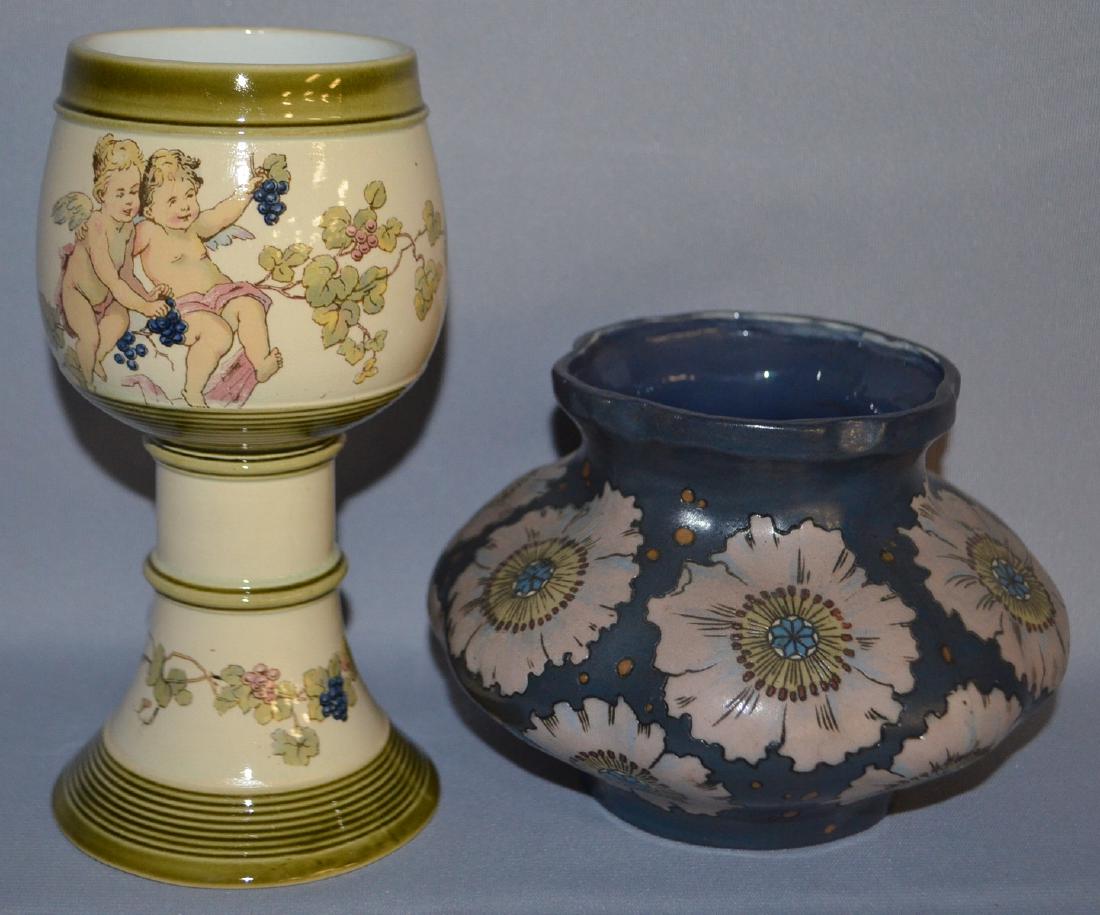 Two Villeroy and Bach Pottery Items: Two Villeroy and Bach Pottery Items, Goblet and Vase: 1.) 1/4 Liter Goblet decorated with cherubs and grapes and marked "1194 Geschutze".; 2.) Squat Vase with stylized flowers and marked with a castle